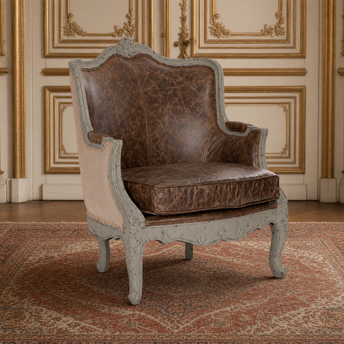 Adele French Carved Birch Leather Club Chair in top-grain leather and burlap, in a gilded French boiserie room