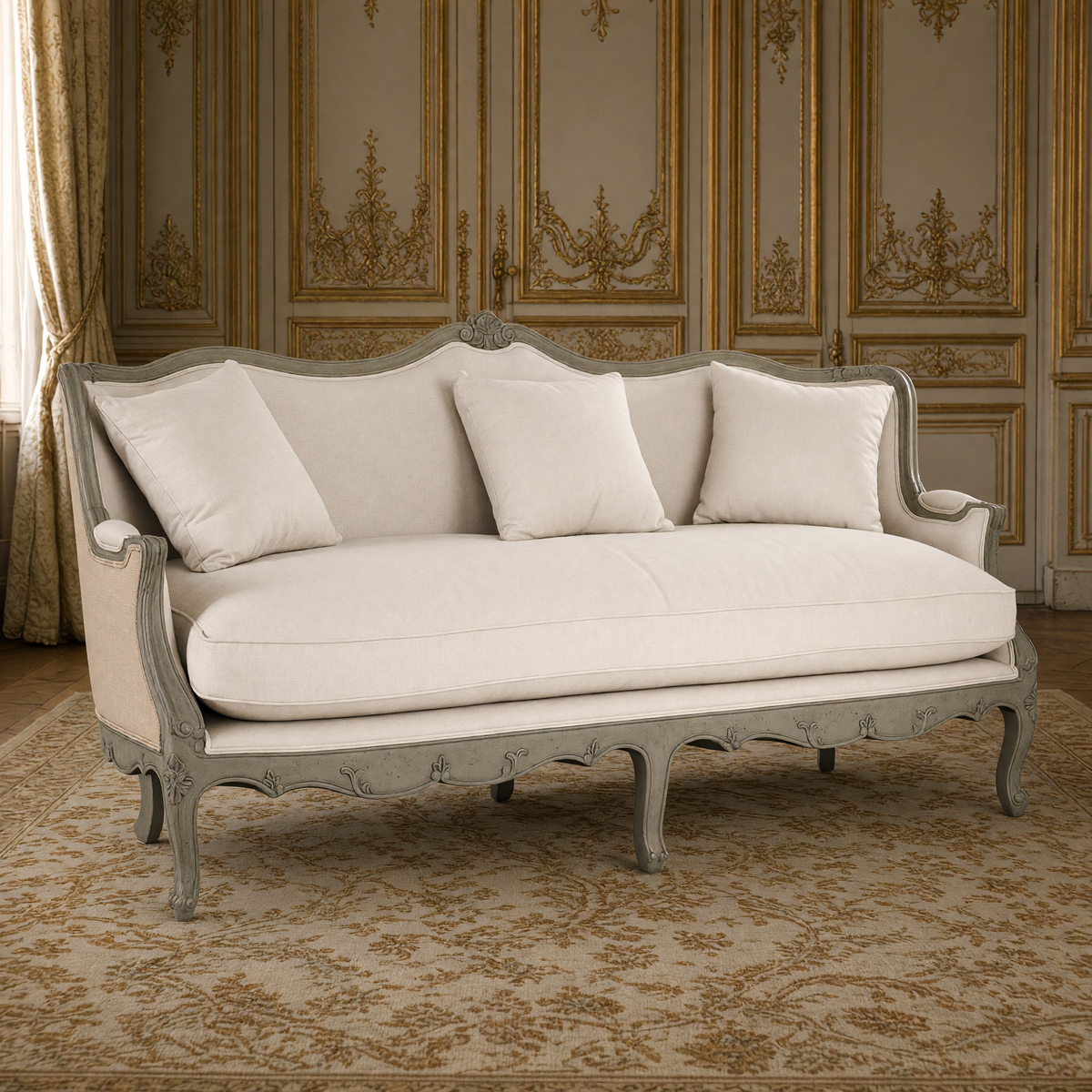 Adele Carved French Cotton Sofa with Burlap Back, in off-white cotton with an antique olive green carved frame and a natural burlap outside back, in a greige and gold French boiserie salon