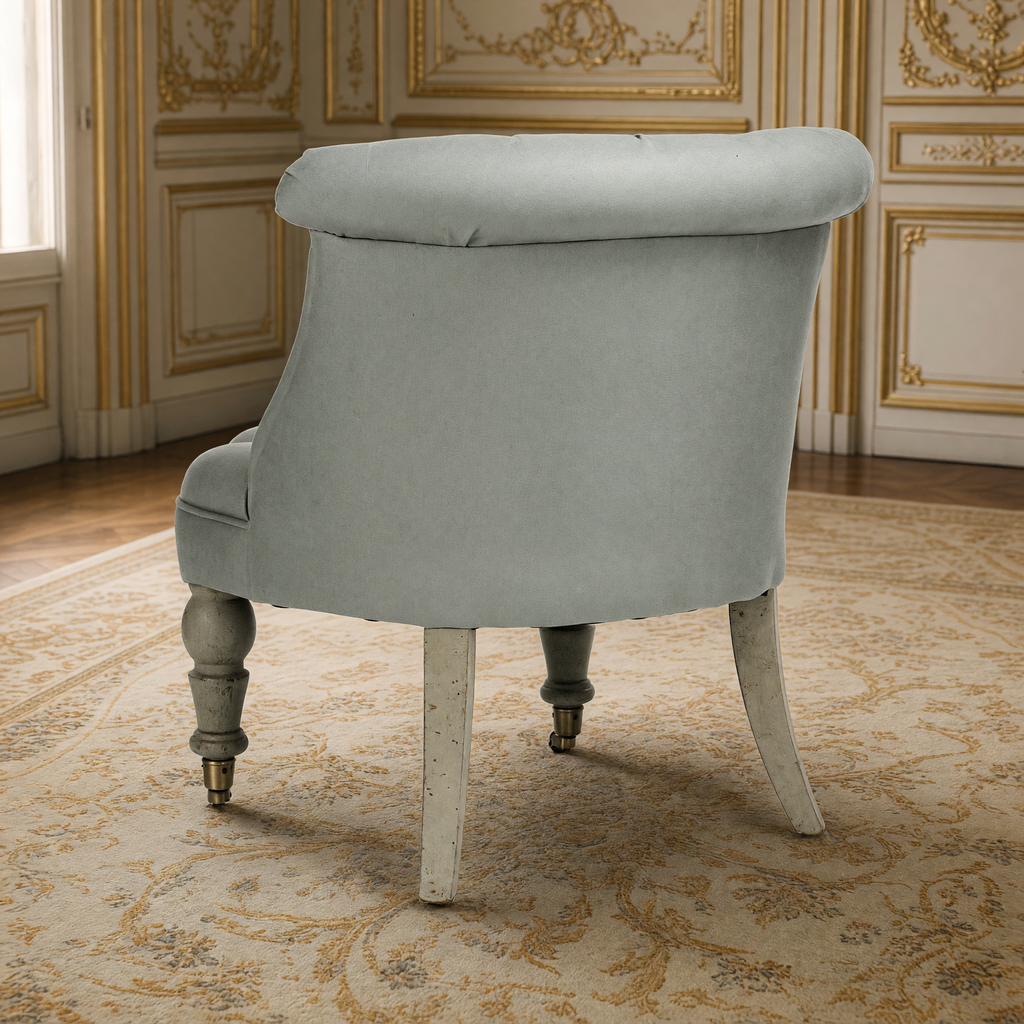 Back view of the Amelie French tufted linen slipper chair in Sage Linen in the same gilded salon