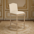 Aria French Turned Oak Bar Stool in Natural Linen, Recycled Oak, three-quarter view in a French salon on an antique Aubusson carpet