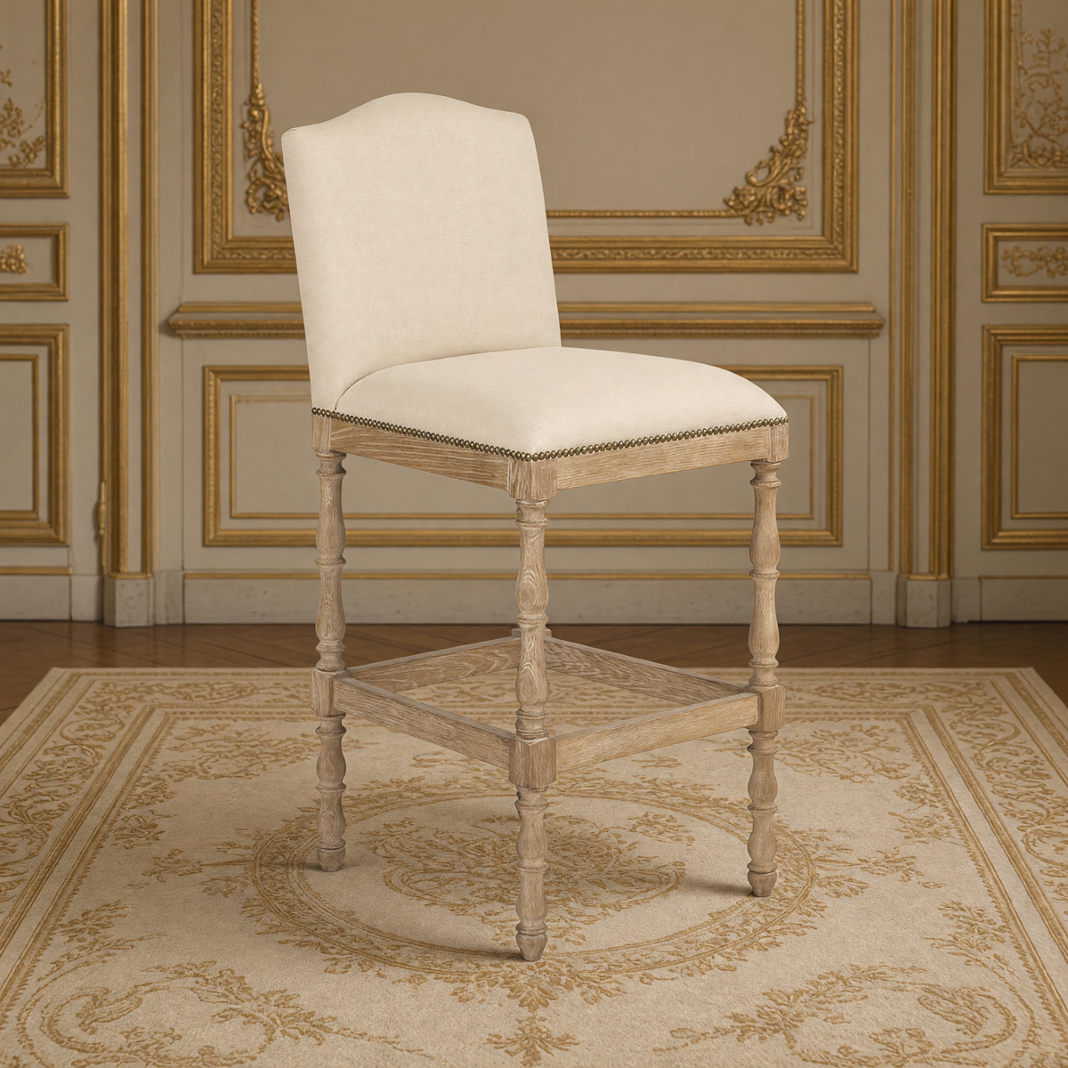 Aria French Turned Oak Bar Stool in Natural Linen, Recycled Oak, three-quarter view in a French salon on an antique Aubusson carpet