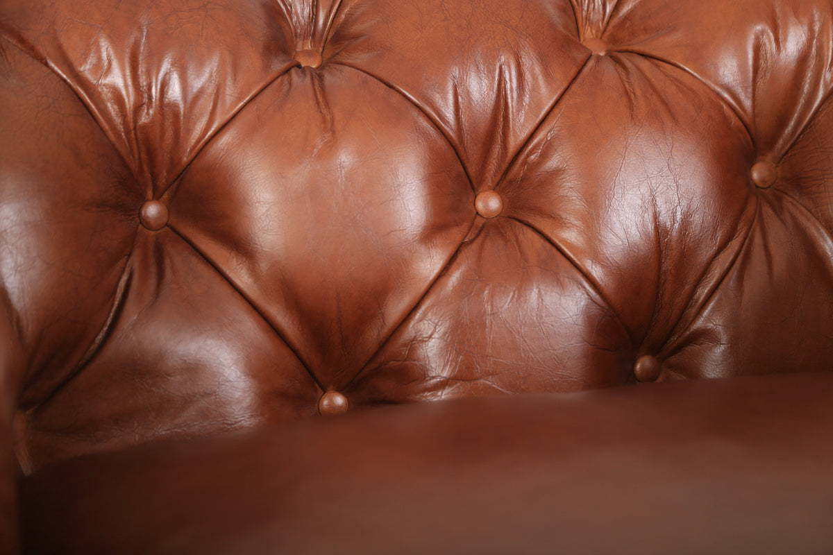 Close-up of the hand-tufted leather back of the Arthur Chesterfield Leather Arm Chair