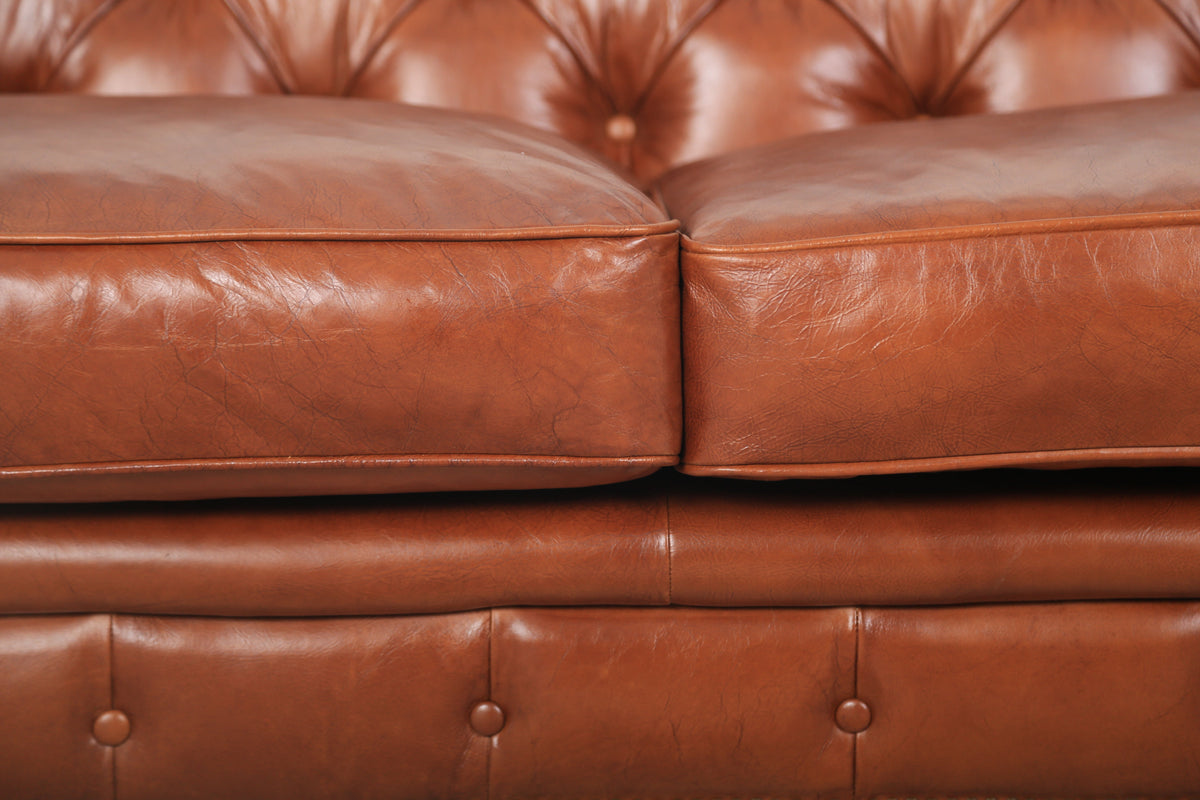 Close-up of the top-grain leather seat of the Arthur Chesterfield Leather Sofa