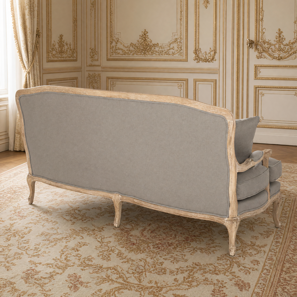 Back view of the Bastille sofa showing the linen back and carved oak frame