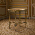 Burkett Louis XVI Gilded Pine Side Table in Antiqued Gold on an antique Aubusson carpet in a taupe boiserie salon