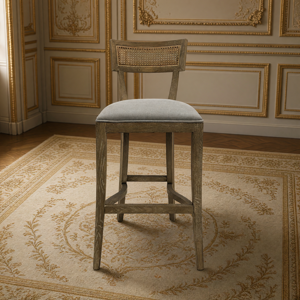 Carvell Cane Back Oak Bar Stool in Grey Linen, front view in a French salon on an Aubusson carpet