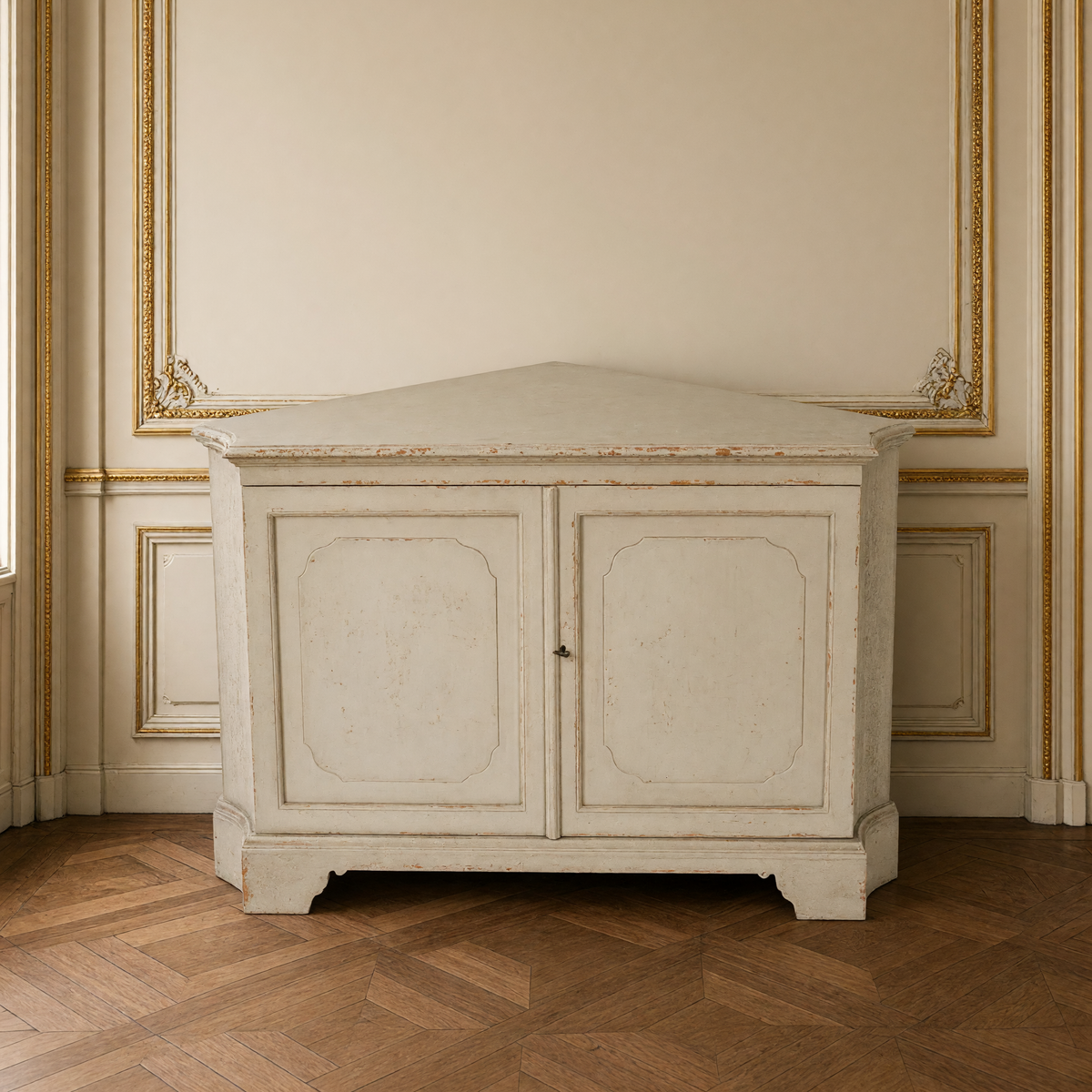 Lower section of the Dennis Painted Pine Corner Cabinet in Distressed Grey showing the paneled doors and bracket feet