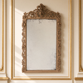 Estelle French carved walnut wall mirror in natural walnut, hanging in a warm ivory Louis XVI boiserie salon