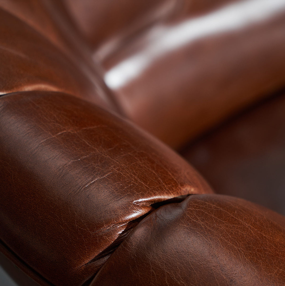 Close-up of the aged Italian leather of the George Classic Italian Leather Wingback Chair