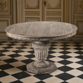 Kilo French Carved Elm Pedestal Dining Table in a Louis XVI dining room with a checkerboard marble floor
