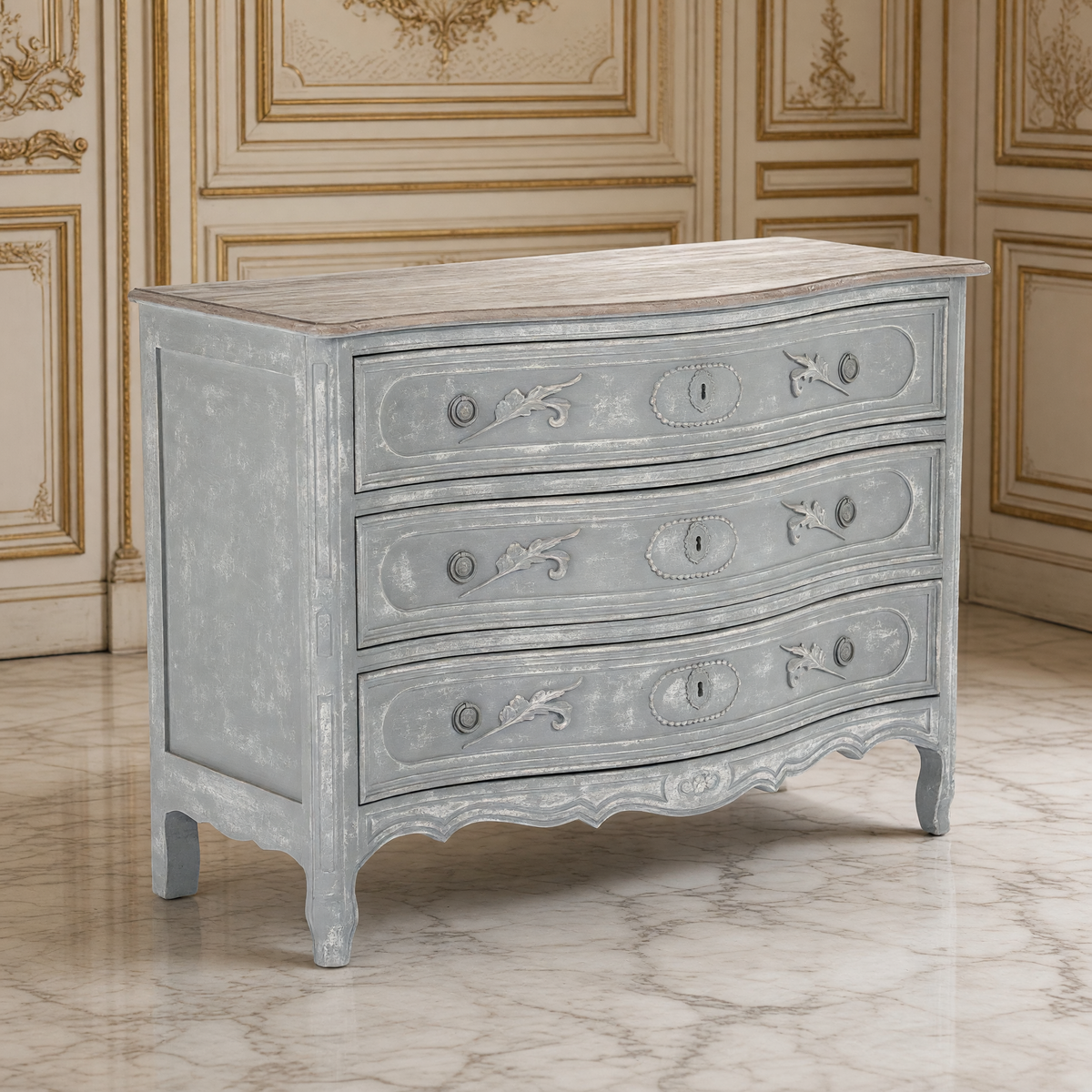 Lennon French Carved Serpentine Chest in Distressed Grey in an ivory and gold French boiserie salon on cream marble