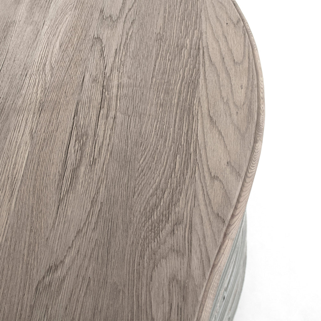 Lennon French Carved Serpentine Chest in Distressed Grey, studio detail photo 4 of 5 of the natural weathered wood top