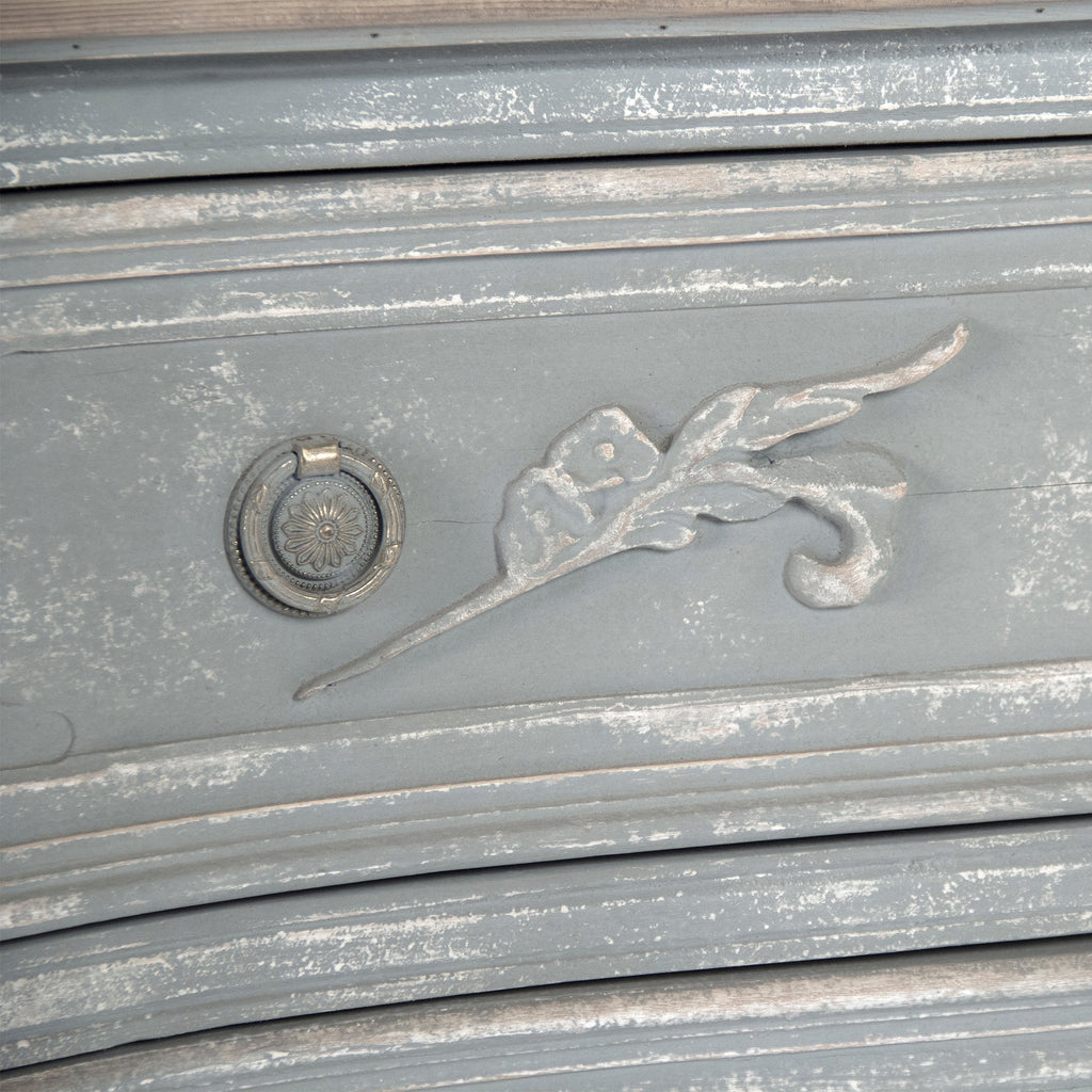 Lennon French Carved Serpentine Chest in Distressed Grey, studio detail photo 5 of 5 of the carved leaf motif and ring pull