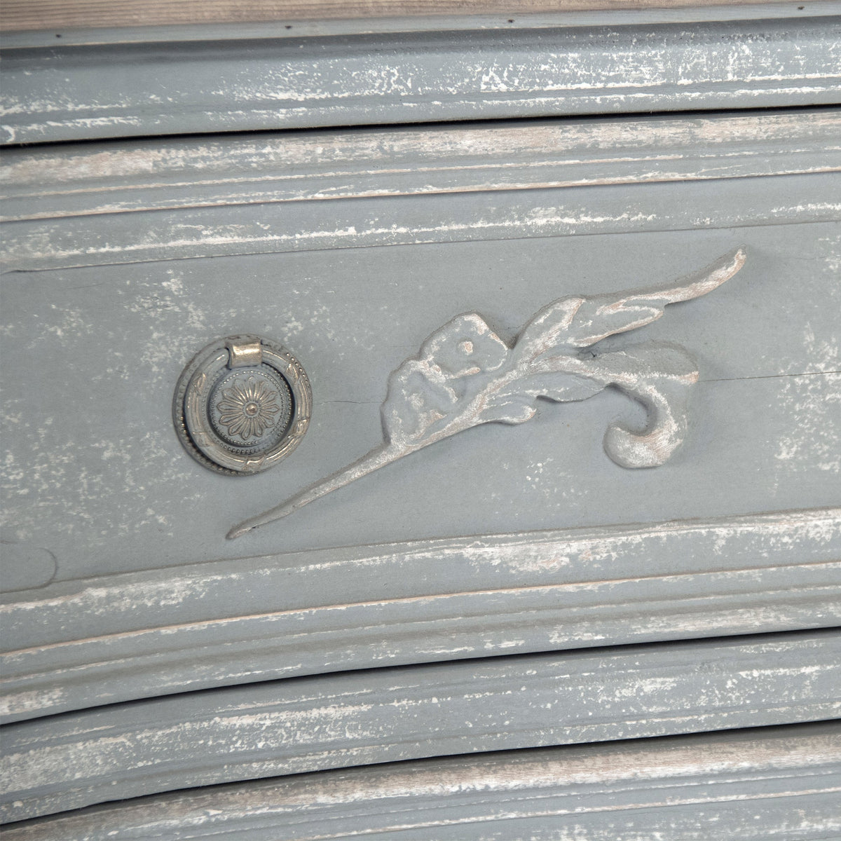 Lennon French Carved Serpentine Chest in Distressed Grey, studio detail photo 5 of 5 of the carved leaf motif and ring pull