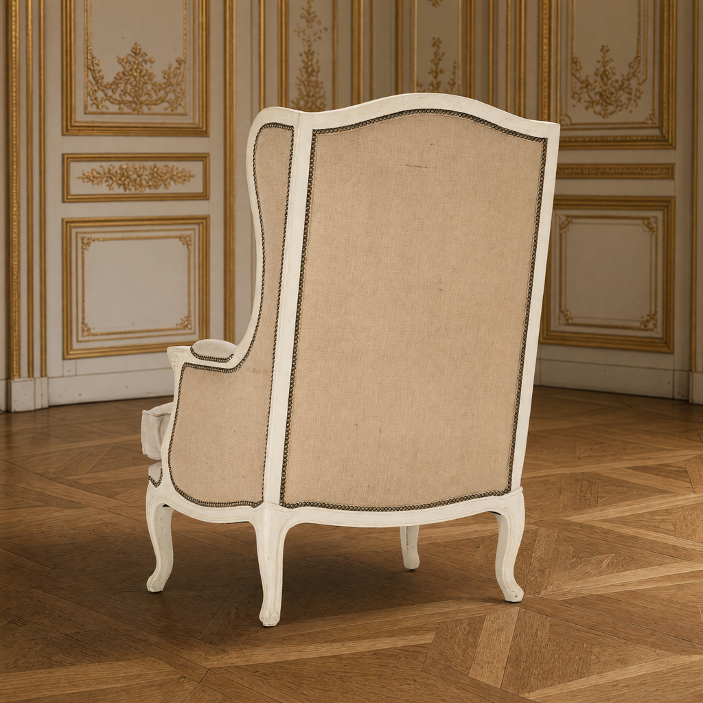 Leon French Linen Wingback Chair in Distressed Ivory Pine, back view showing the burlap back in a gilded Louis XVI salon