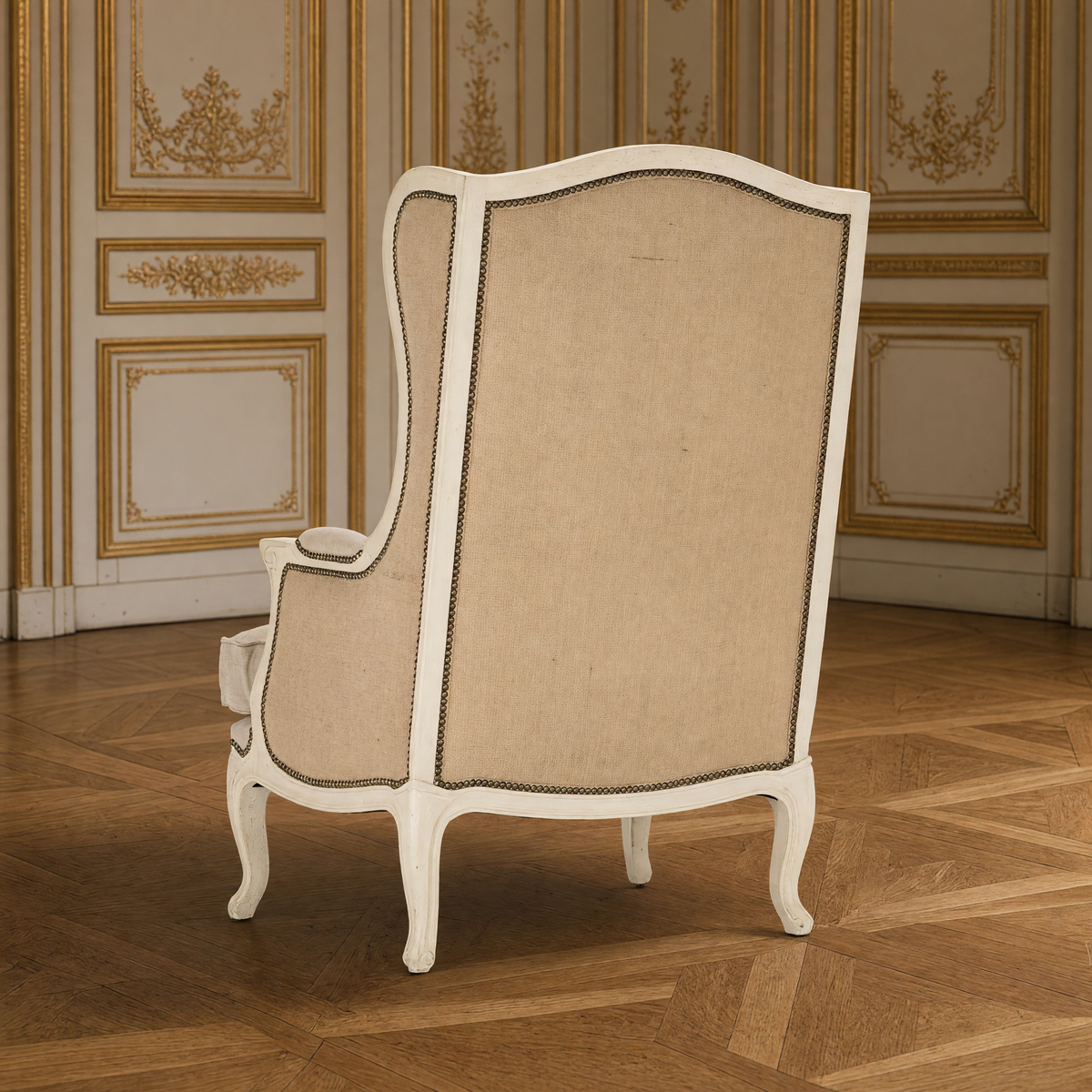 Leon French Linen Wingback Chair in Distressed Ivory Pine, back view showing the burlap back in a gilded Louis XVI salon