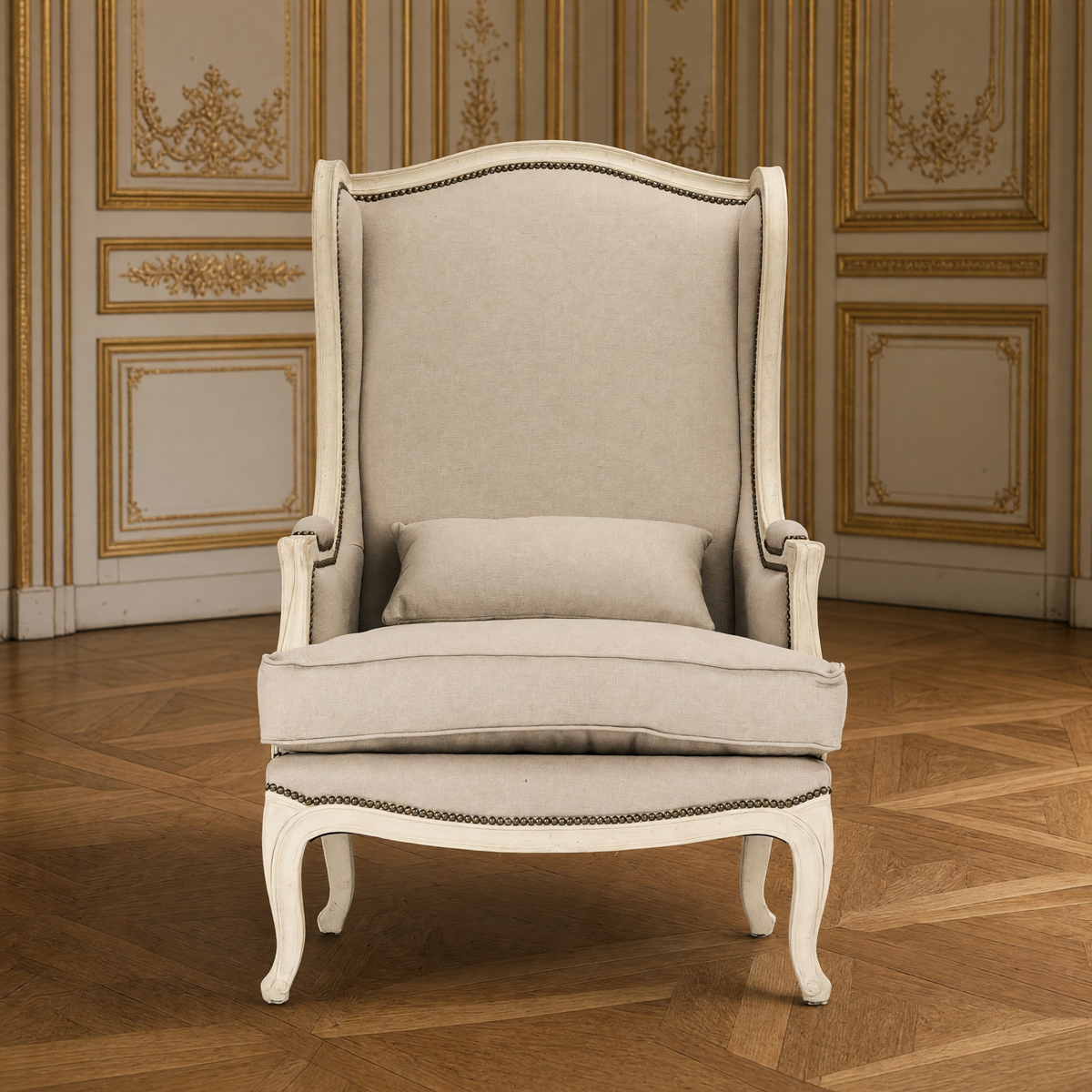 Leon French Linen Wingback Chair in Distressed Ivory Pine, front view in a gilded Louis XVI salon