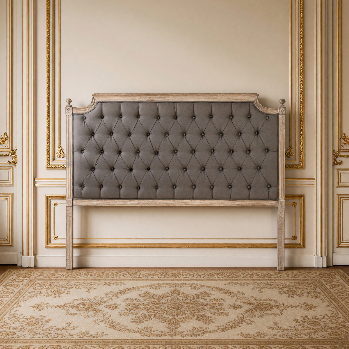 Louis queen tufted headboard in aubergine linen on limed grey oak against a French boiserie wall over an antique Aubusson carpet