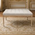 Louis tufted ottoman in natural linen on natural oak in a French boiserie salon