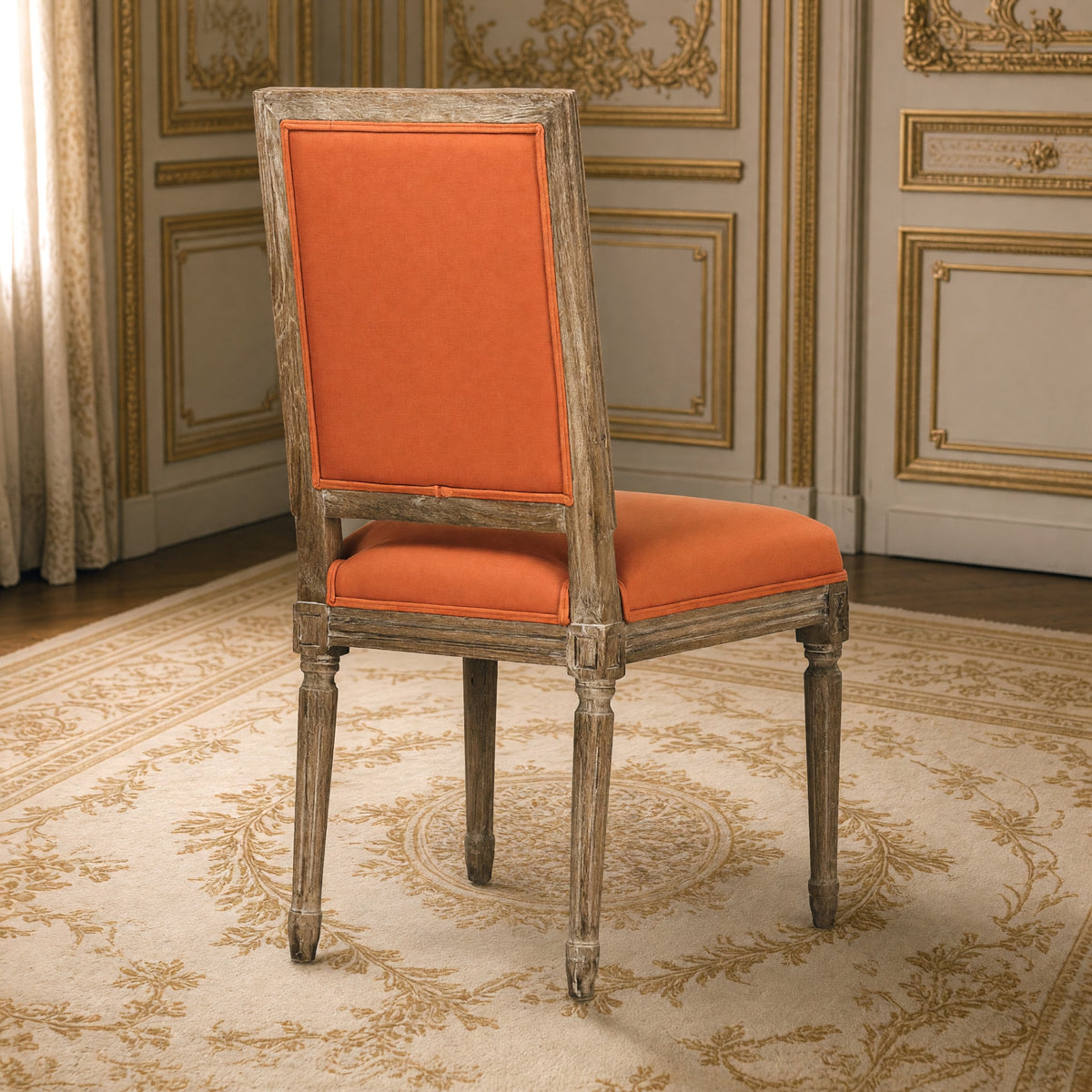 Rear three-quarter view of the Louis square-back side chair in orange linen cotton on limed grey oak