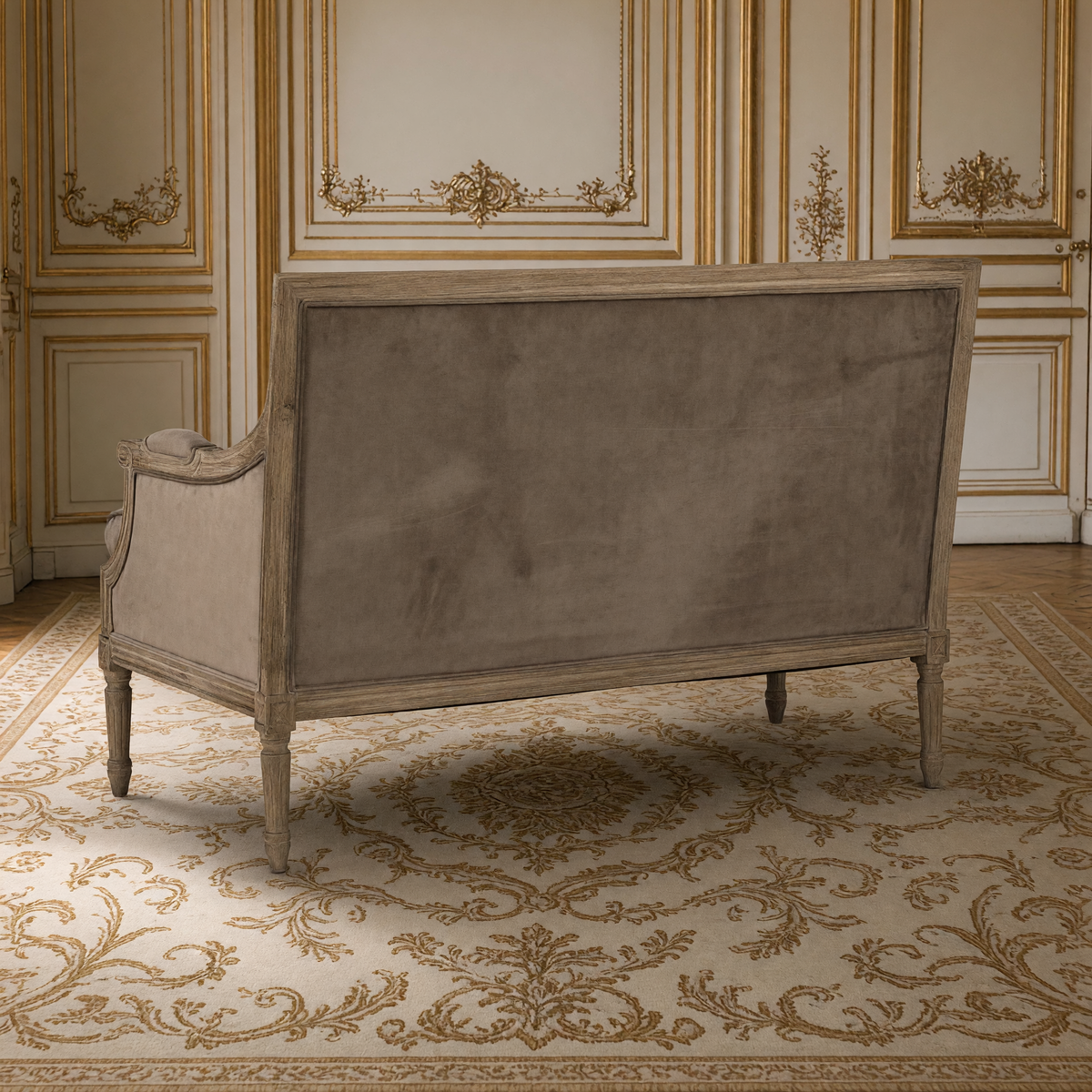 Back view of the Louis settee showing the velvet-covered back and limed oak frame