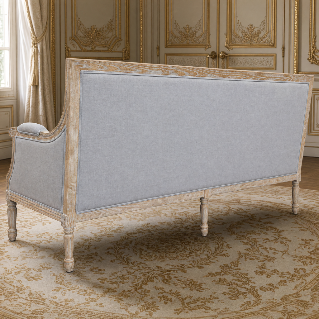 Back view of the Louis Tufted-Back French Sofa in Soft French Gray Linen with its limed grey oak frame