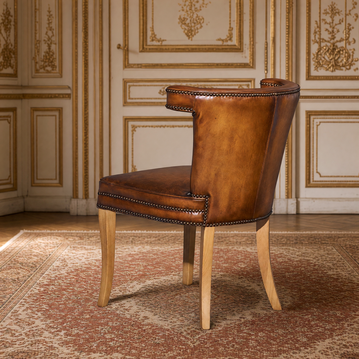 Luca Curved-Back Top-Grain Leather Side Chair in Classic Brown, Mango Wood, rear three-quarter view in a French salon