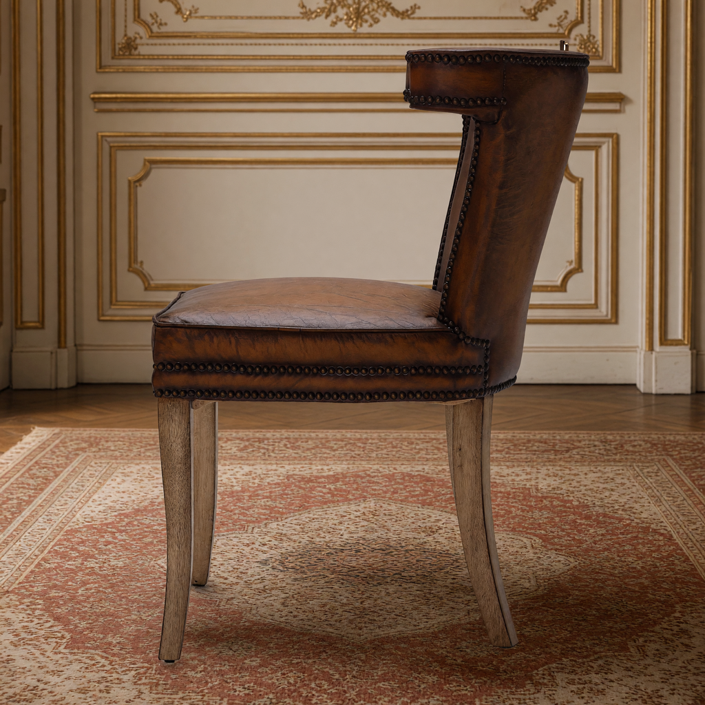 Luca Curved-Back Top-Grain Leather Side Chair in Classic Brown, Solid Wood, side view showing the curved back, in a French salon