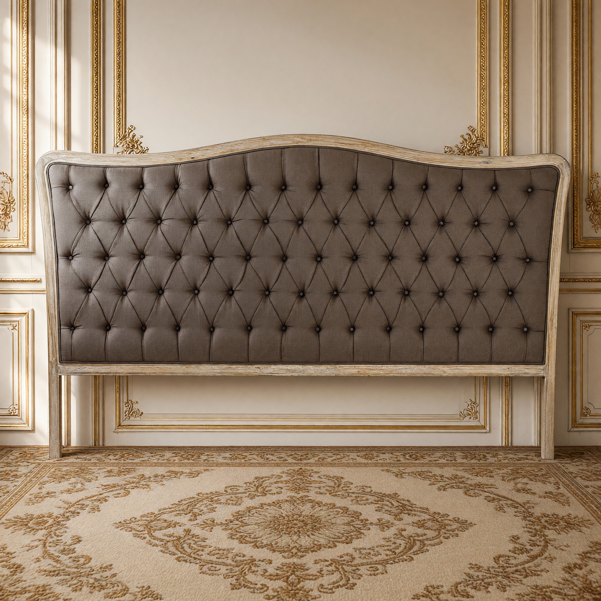 Maison king tufted headboard in aubergine linen on limed grey oak against a French boiserie wall, on an antique Aubusson carpet