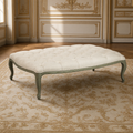Maison tufted ottoman in linen on a birch frame in a French boiserie salon