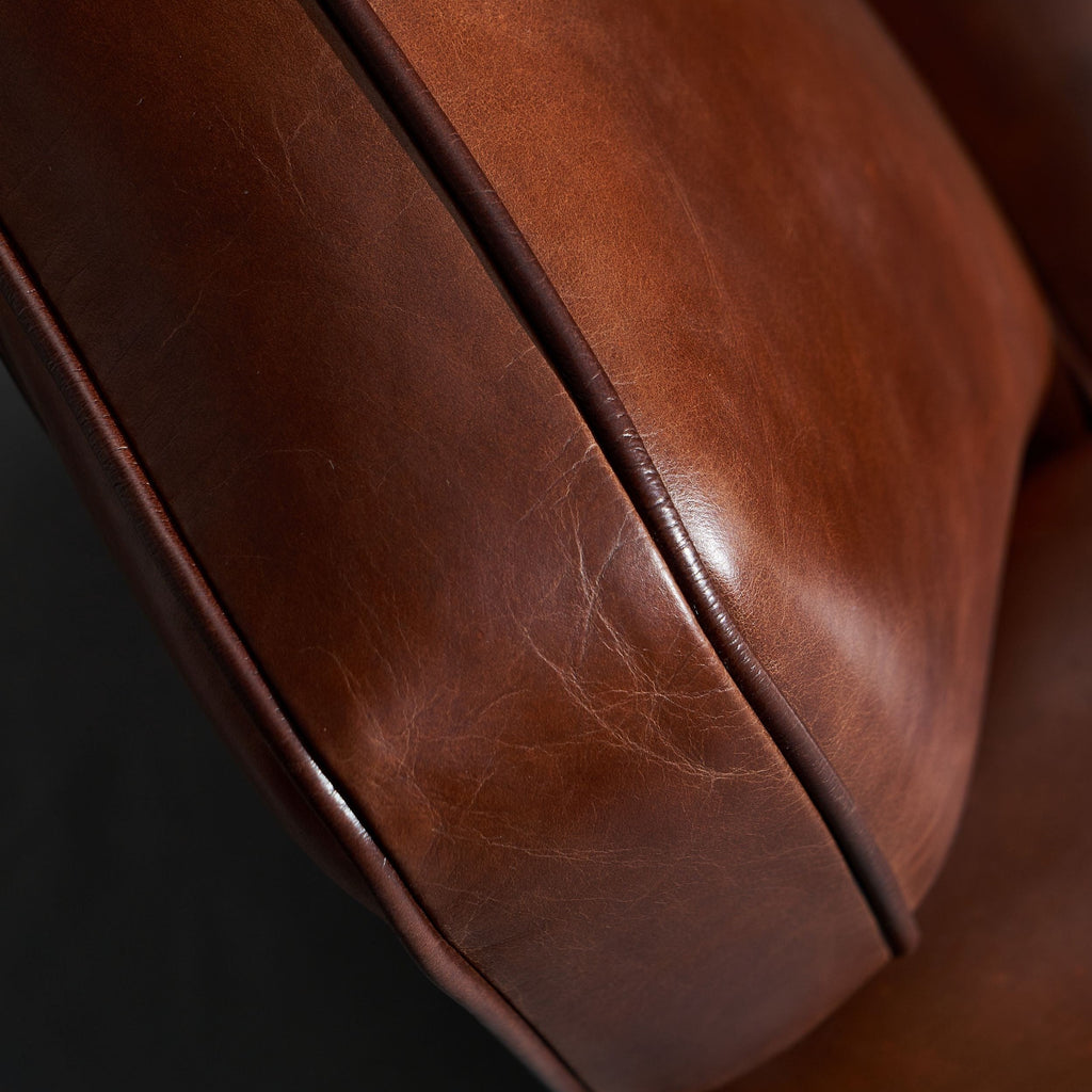 Close-up of the top-grain Italian leather and piping of the Matthew Arm Chair