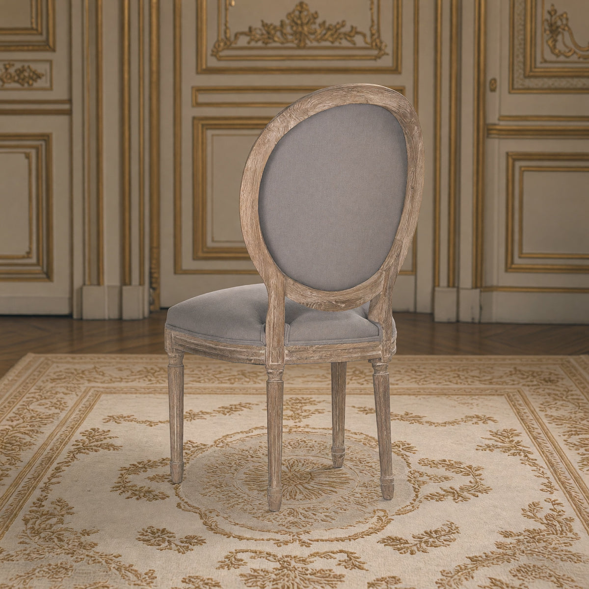 Rear three-quarter view of the Medallion side chair in grey linen on limed grey oak