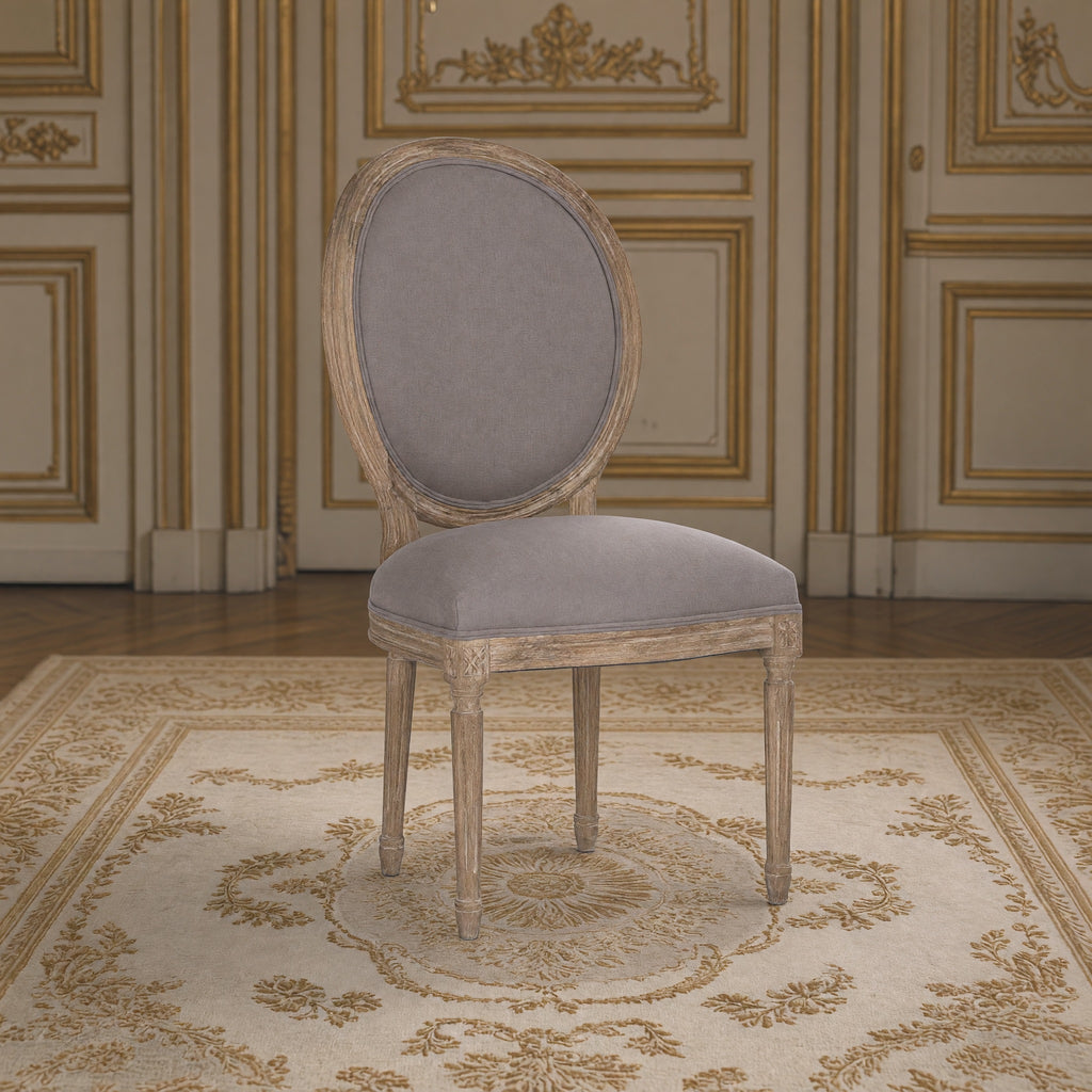 Medallion French oval-back side chair in grey linen, limed grey oak in a gilded Louis XVI salon on an Aubusson carpet