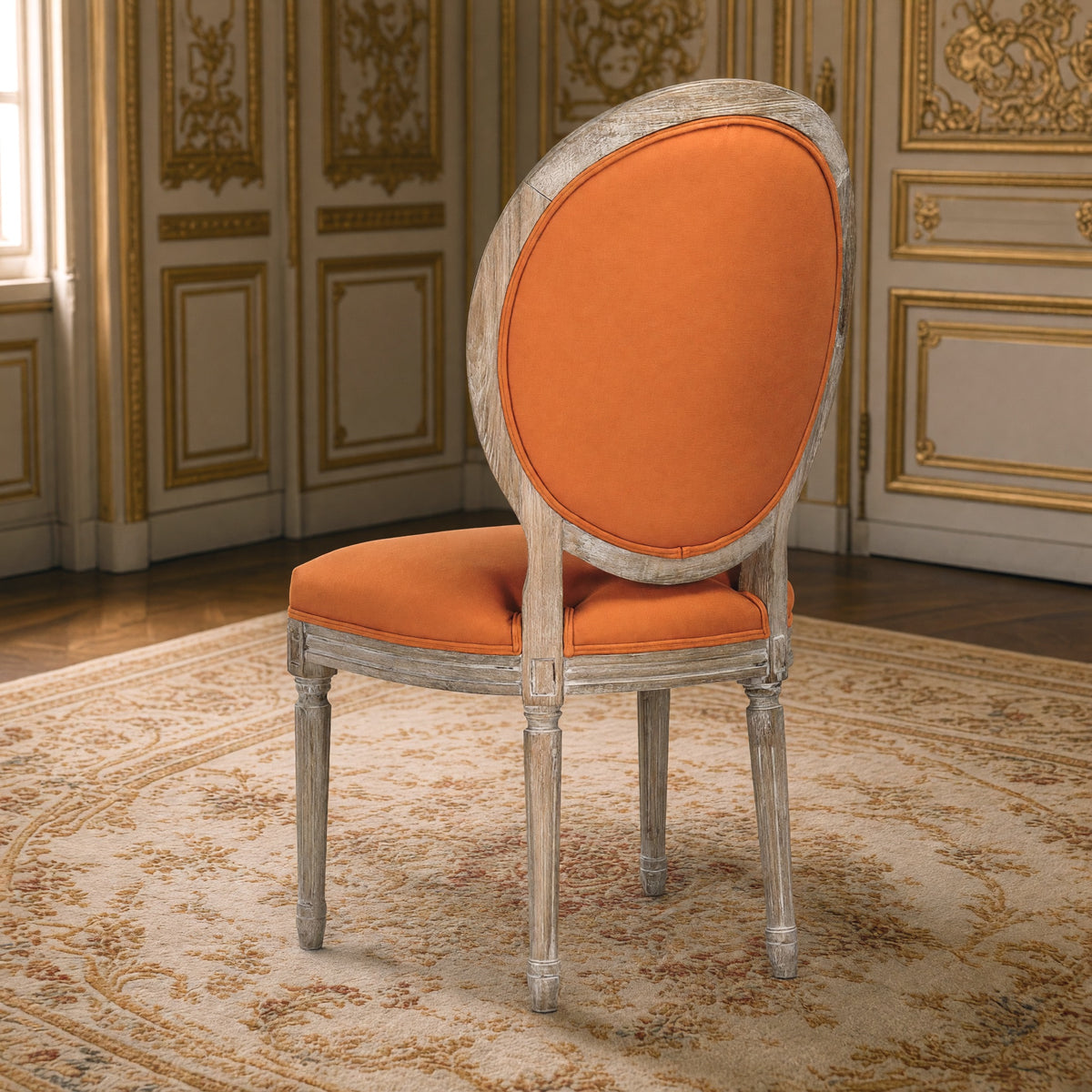Rear three-quarter view of the Medallion tufted side chair in orange linen on limed grey oak