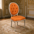 Medallion French tufted oval-back side chair in orange linen, limed grey oak in a gilded Louis XVI salon on an Aubusson carpet