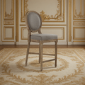 Medallion Louis XVI Oak Counter Stool in Grey Linen, Limed Grey Oak, three-quarter view in a French salon on an antique Aubusson carpet