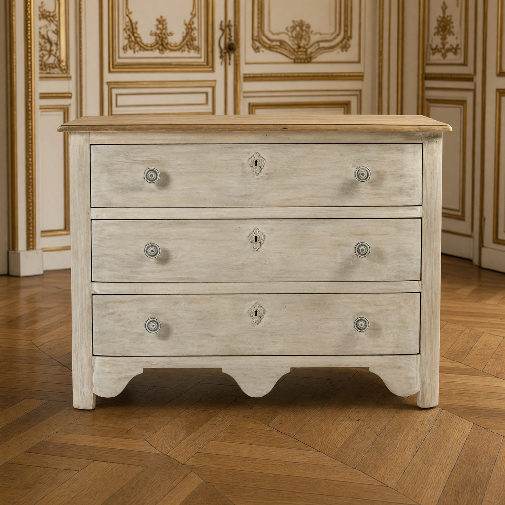 Front view of the Patric French Painted Elm Chest in Whitewash with Natural Top in a French boiserie salon