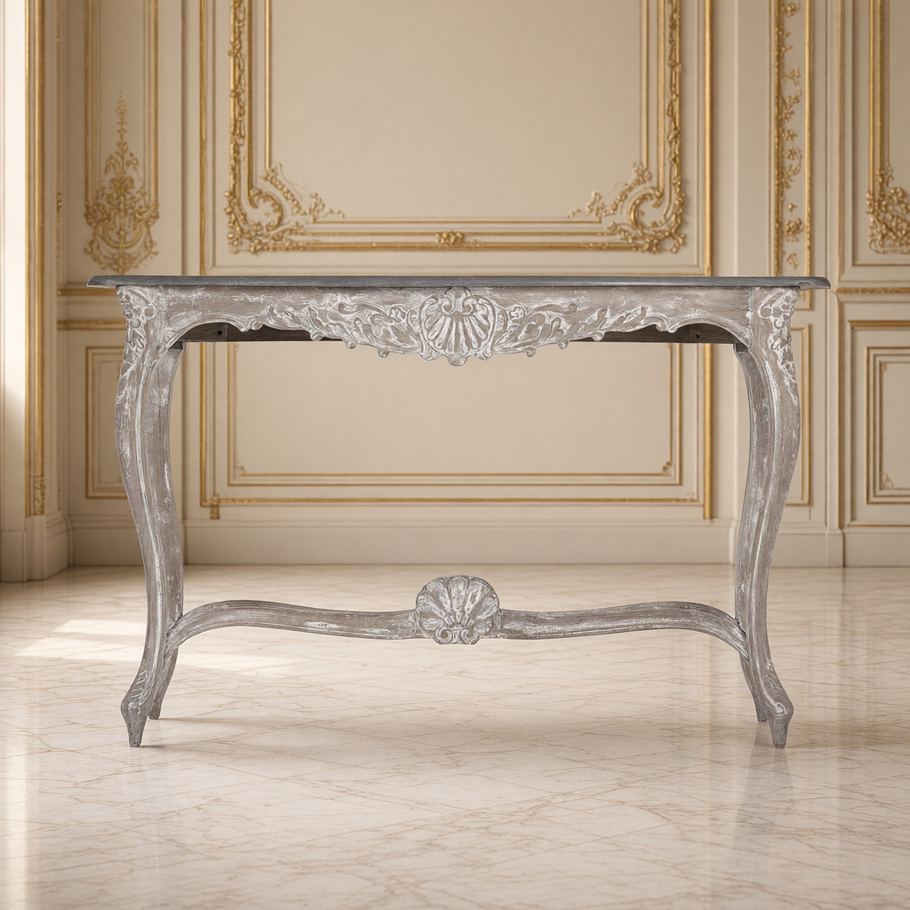 Front view of the Reuben console table showing the carved shell apron and stretcher