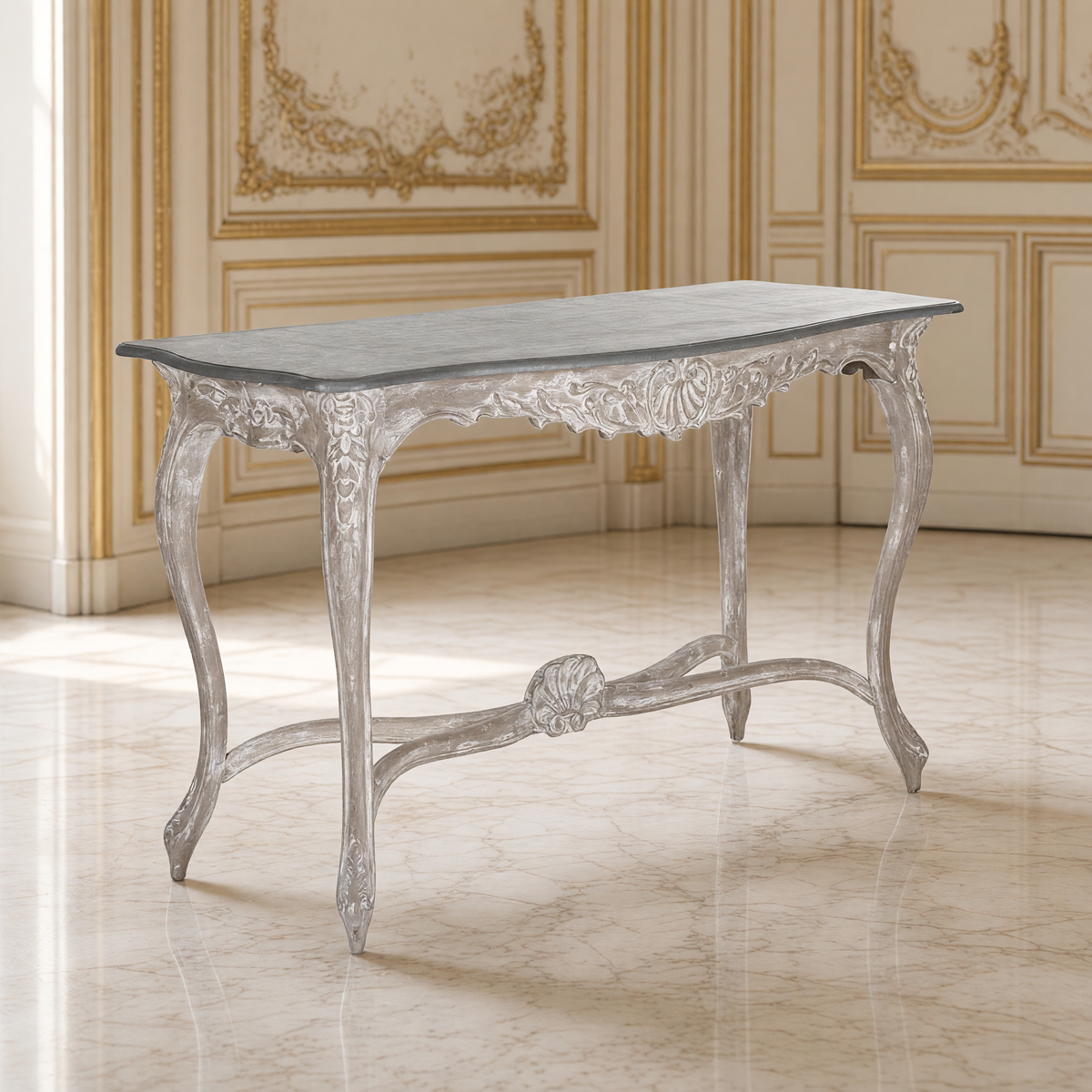 Reuben Louis XV console table with slate-grey top in an ivory and gilded boiserie salon on a cream marble floor