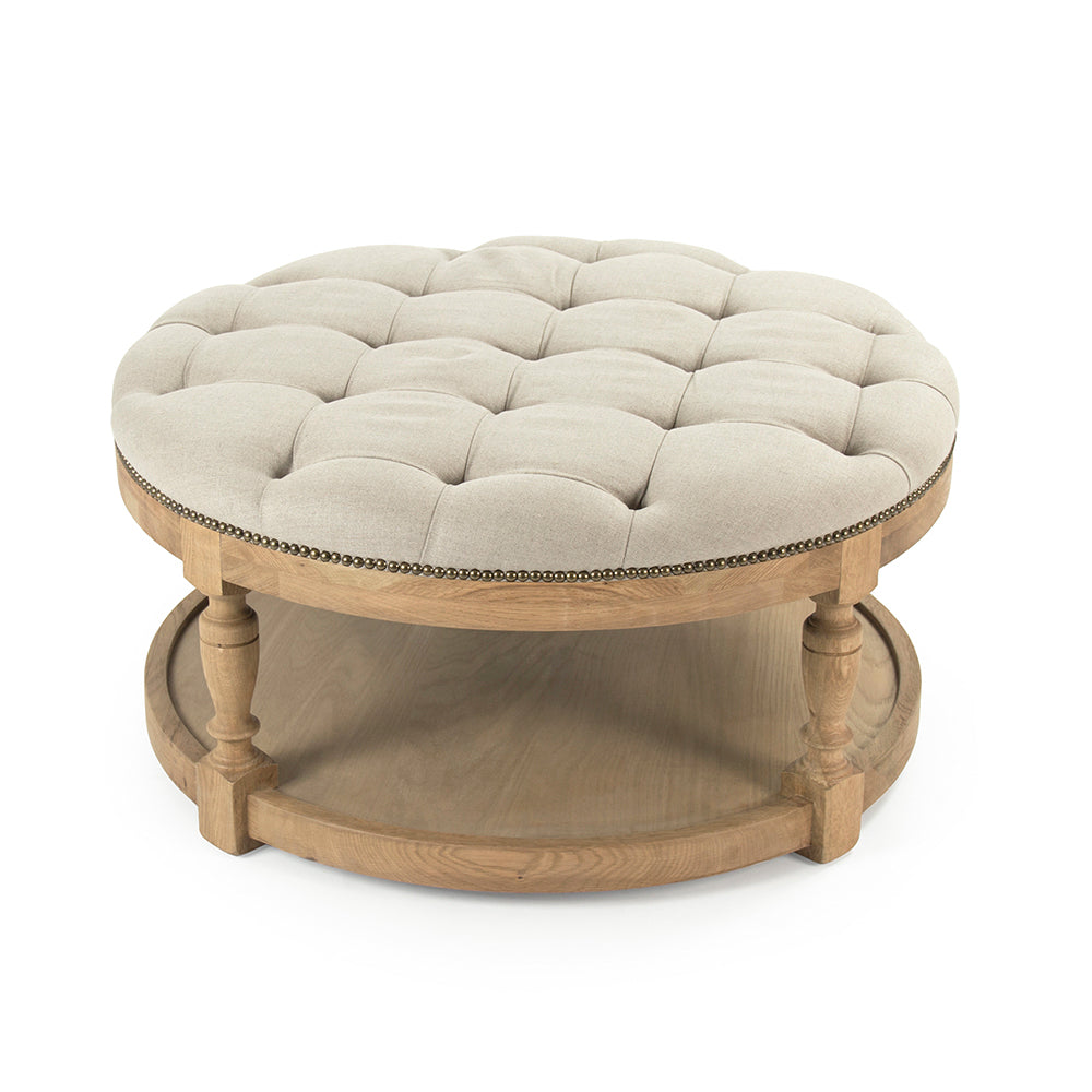 Tammy round ottoman in Natural Oak with nailhead trim, studio photo 1 of 1 on a white background
