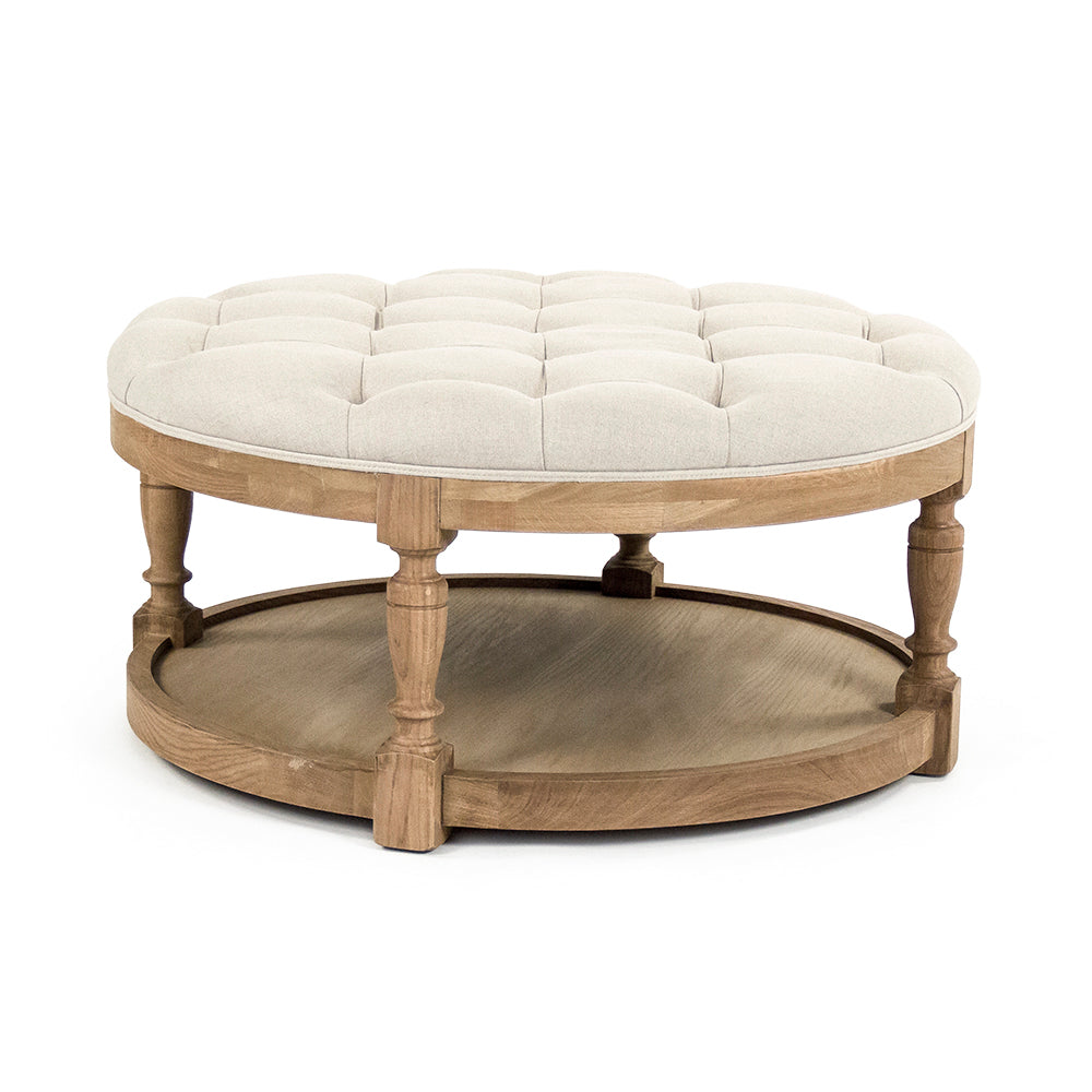 Tammy round ottoman in Natural Oak (no nailhead), studio photo 1 of 1 on a white background