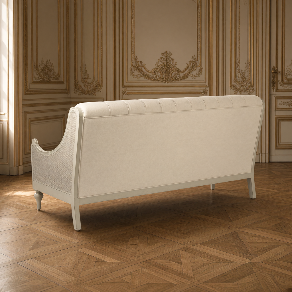 Back view of the Walsh French Tufted Linen Sofa with its white linen back and cane side